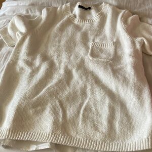 Elegant Cream Knit Top with Pocket